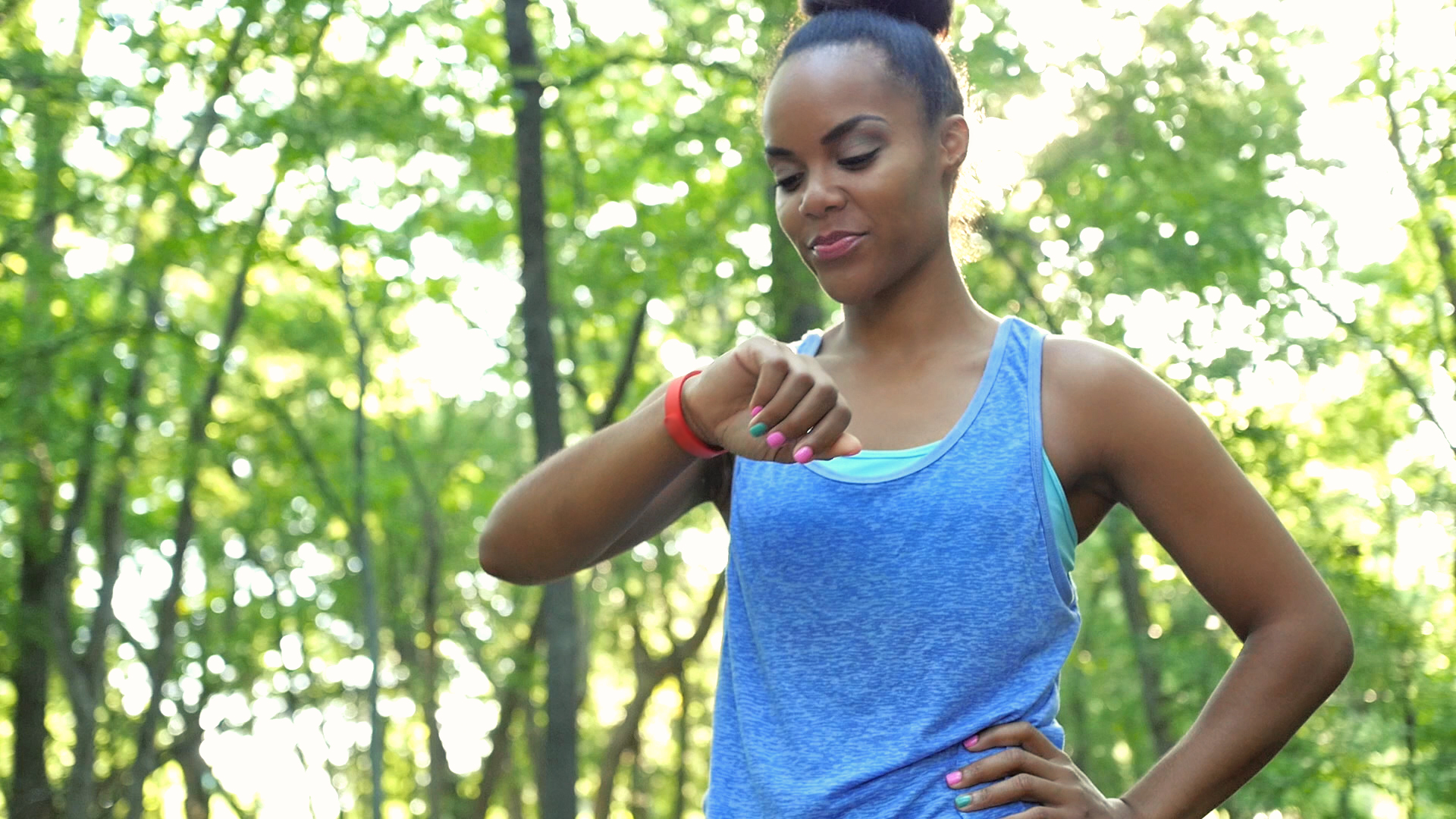 woman looking at FitBit